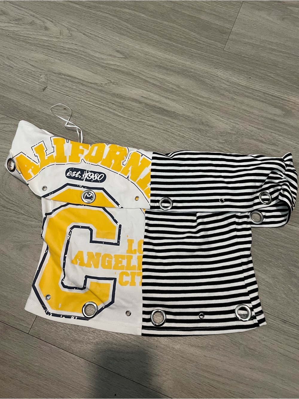 AKIRA Black & White Striped Half-and-Half Crop Top with Yellow Graphic